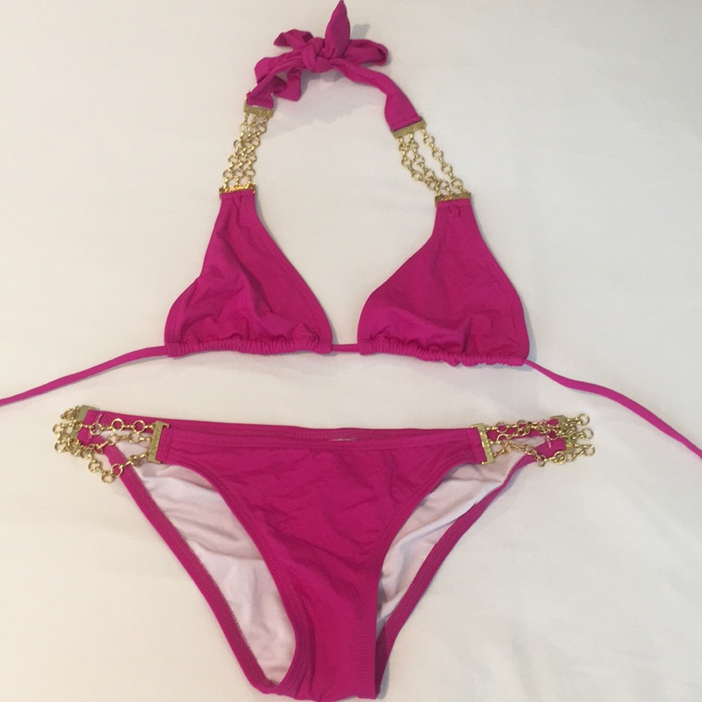 L-Space pink swimsuit with gold metal detail